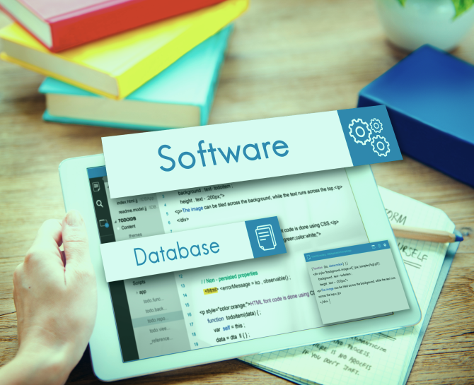 A person holding a tablet displaying code for software and database concepts, with colorful books in the background.