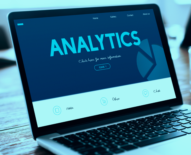 A laptop displaying a website homepage titled "Analytics," featuring navigation options and a prominent "Click" button.