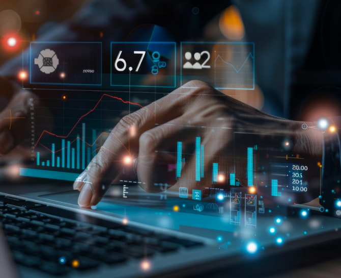 A hand interacts with a laptop displaying digital graphs and data analytics, emphasizing technology and data analysis.